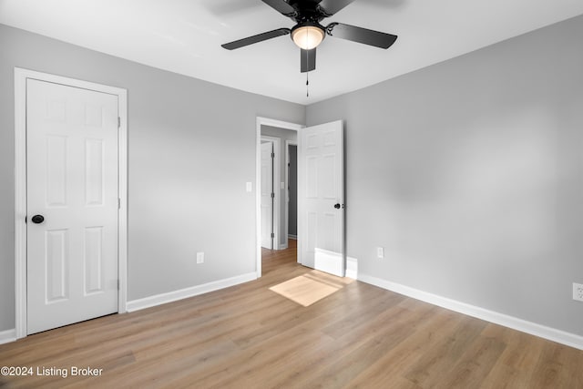 unfurnished bedroom featuring ceiling fan and light hardwood / wood-style flooring