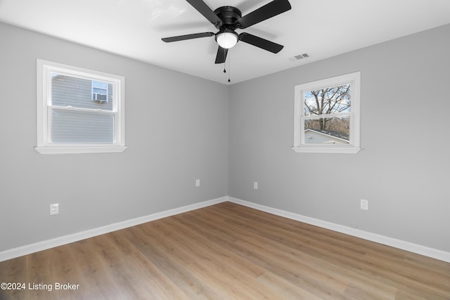 spare room featuring ceiling fan and light wood-type flooring