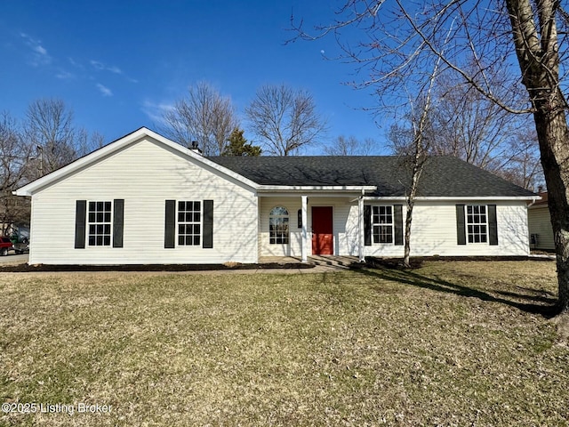 ranch-style home featuring a front yard and a shingled roof