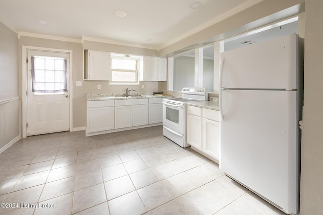 kitchen featuring white appliances, white cabinetry, a healthy amount of sunlight, and sink