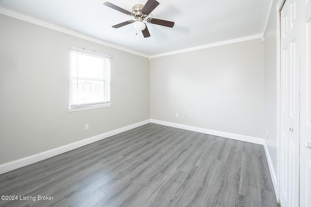 unfurnished room with crown molding, ceiling fan, and hardwood / wood-style flooring