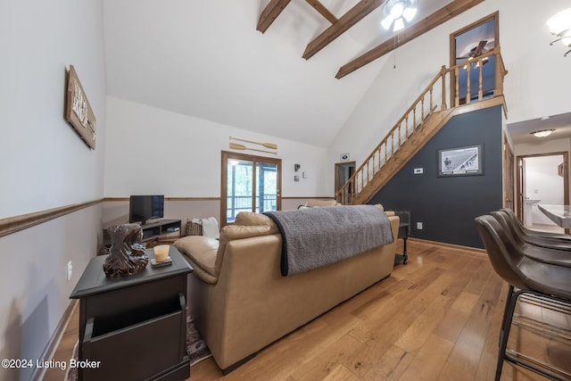315 Timberlake Ln, Mcdaniels, KY 40152 - living area featuring high vaulted ceiling, stairs, light wood-type flooring, and beam ceiling
