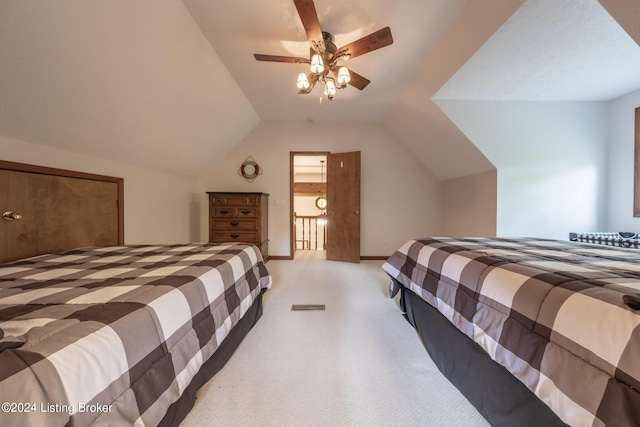 bedroom with light colored carpet, vaulted ceiling, and ceiling fan