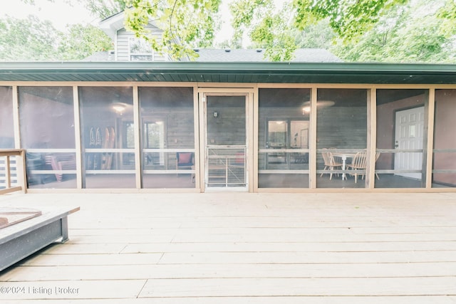 wooden terrace featuring a sunroom