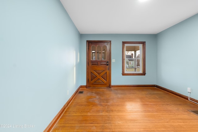 empty room with light hardwood / wood-style floors