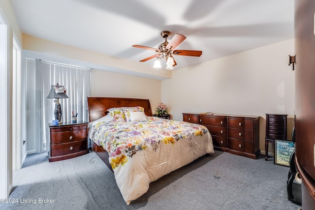 bedroom with ceiling fan and light colored carpet