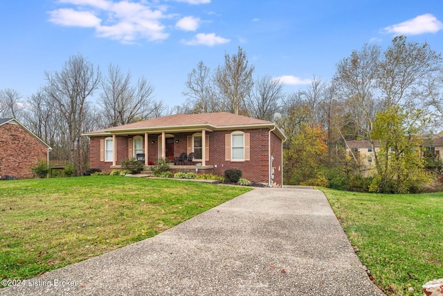 single story home with covered porch and a front lawn