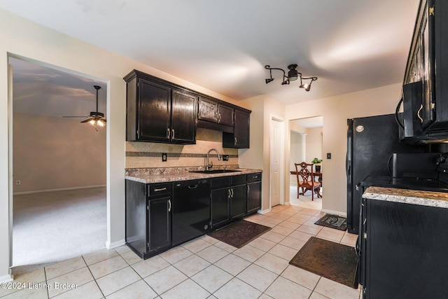 kitchen with dishwasher, sink, ceiling fan, light tile patterned floors, and tasteful backsplash