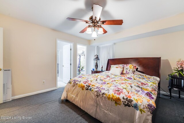 carpeted bedroom featuring ensuite bath and ceiling fan