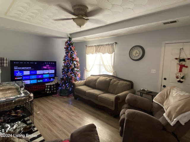 living room with light wood-type flooring and ceiling fan