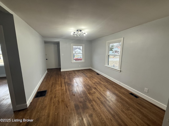 empty room featuring dark wood-type flooring