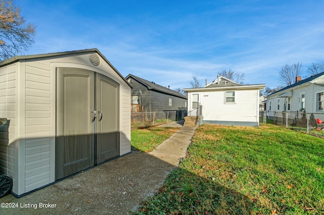 view of outbuilding with a lawn