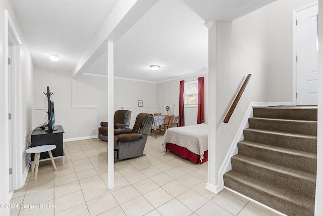 tiled bedroom featuring ornamental molding