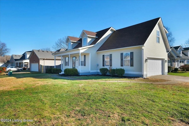 cape cod house with covered porch, a garage, and a front lawn