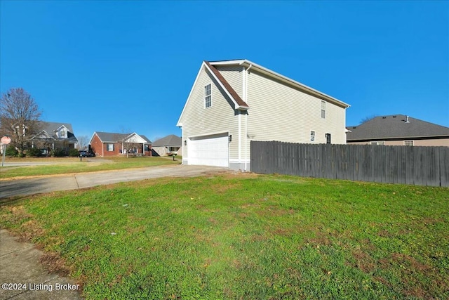 view of property exterior featuring a garage and a yard