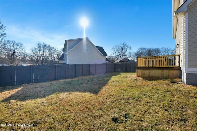 view of yard with a wooden deck