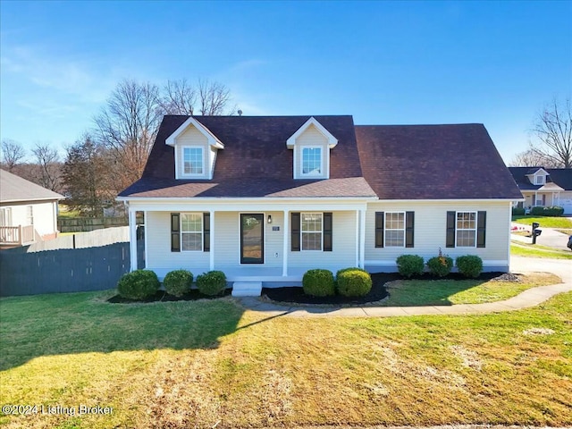 cape cod home featuring a porch and a front yard