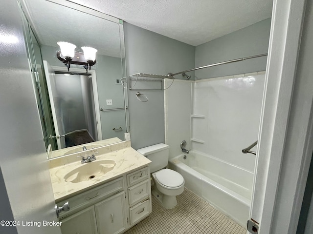 full bathroom featuring vanity, tile patterned floors, shower / washtub combination, toilet, and a textured ceiling