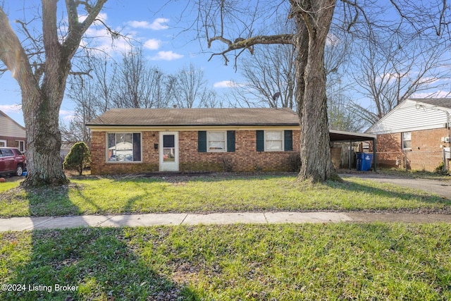 single story home with a carport and a front lawn