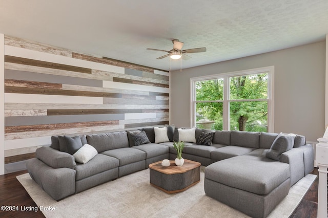 living room with ceiling fan and hardwood / wood-style floors