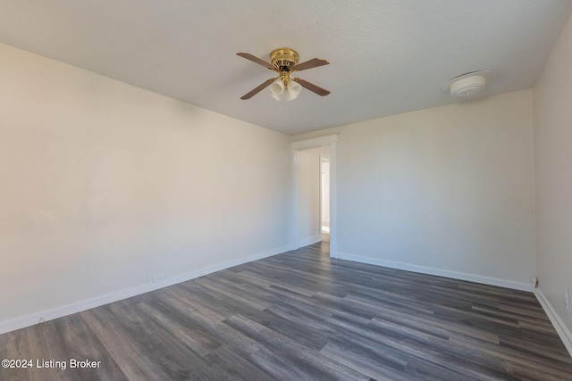 unfurnished room featuring ceiling fan, dark hardwood / wood-style flooring, and a textured ceiling