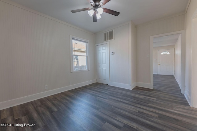 unfurnished room featuring dark hardwood / wood-style floors and ceiling fan