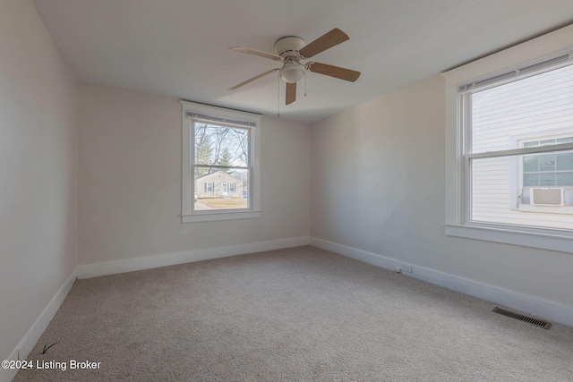 unfurnished room with carpet flooring and ceiling fan