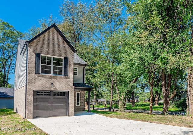 view of front property with a front yard and a garage