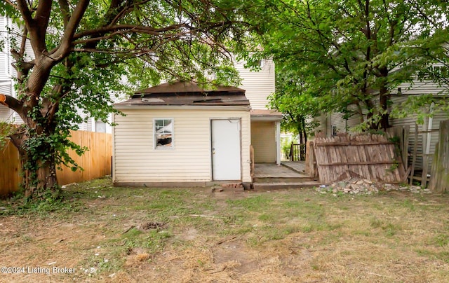 view of outdoor structure featuring a lawn