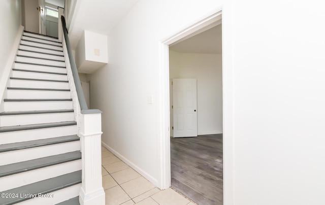 staircase featuring hardwood / wood-style flooring