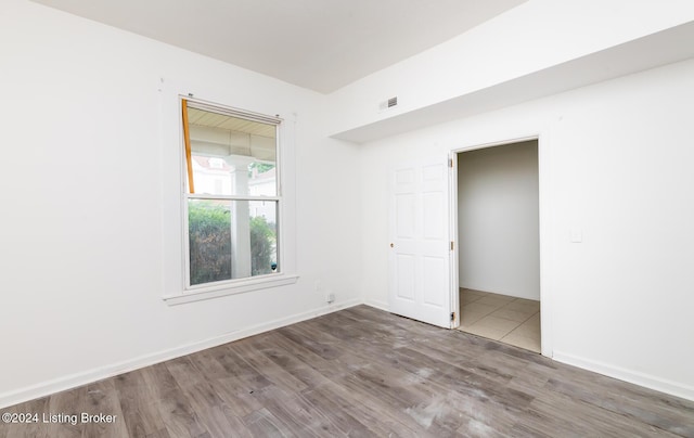 empty room with wood-type flooring