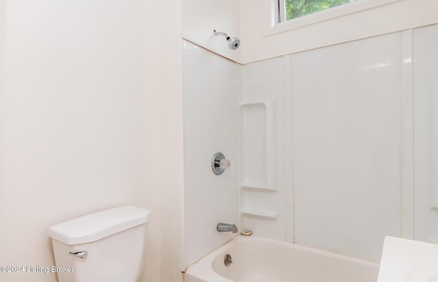 bathroom with toilet and shower / washtub combination