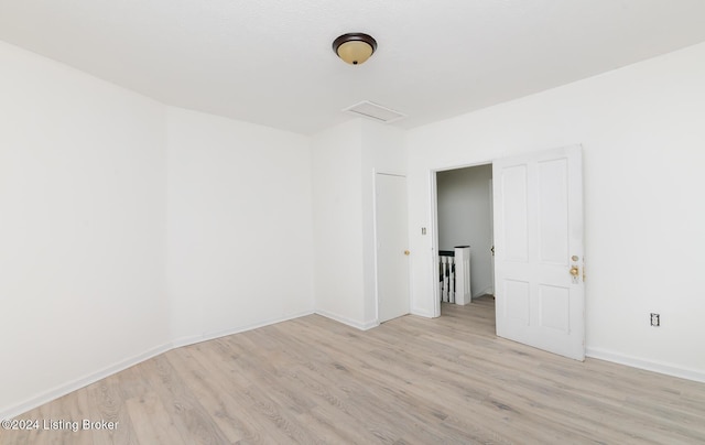 empty room with light hardwood / wood-style floors