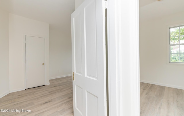 corridor featuring light wood-type flooring