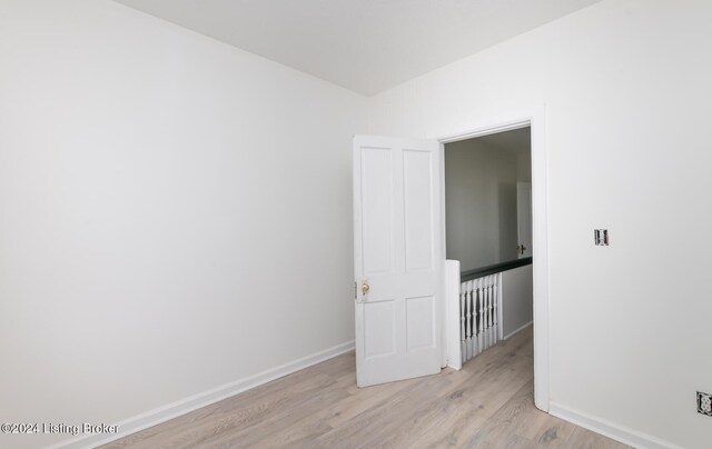 spare room featuring light wood-type flooring