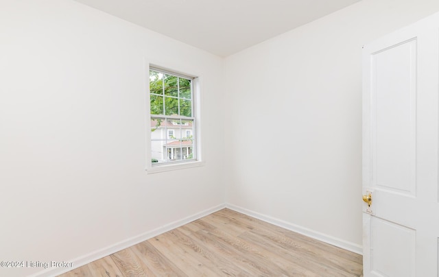 spare room featuring light hardwood / wood-style floors