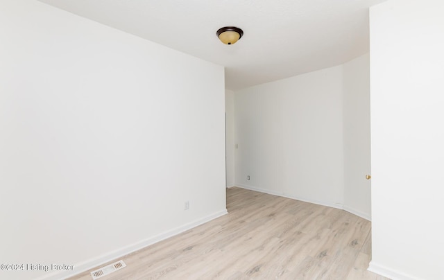 unfurnished room featuring light hardwood / wood-style flooring