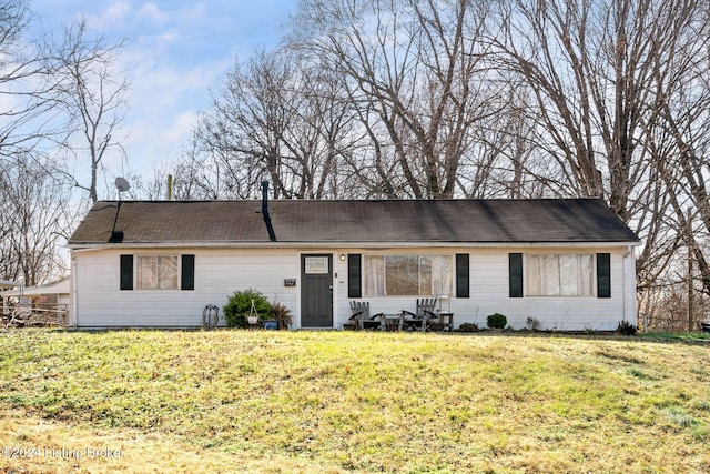 ranch-style home with a front lawn