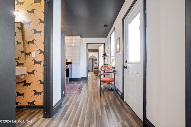 hallway featuring dark hardwood / wood-style flooring