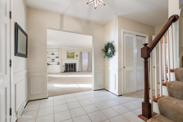 view of carpeted entrance foyer