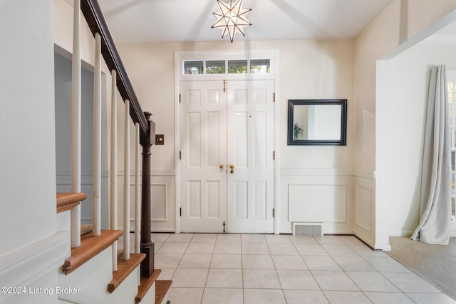 entryway featuring light tile patterned floors