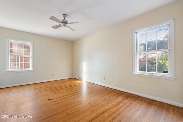 unfurnished room with ceiling fan and light hardwood / wood-style floors