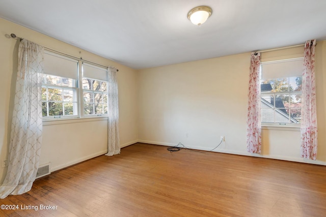 spare room with light wood-type flooring