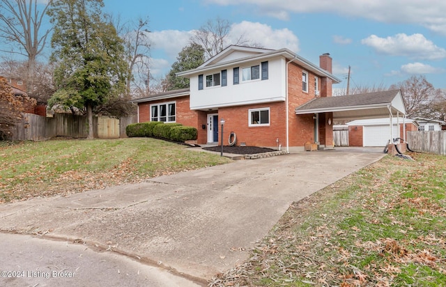 view of front of property with a front yard and a garage