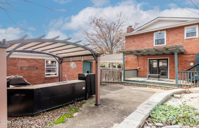 exterior space featuring a pergola and a patio