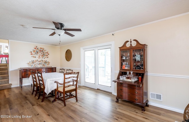 dining space featuring ceiling fan, hardwood / wood-style floors, and a healthy amount of sunlight