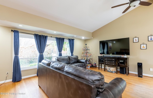 living room featuring ceiling fan, high vaulted ceiling, and light hardwood / wood-style flooring