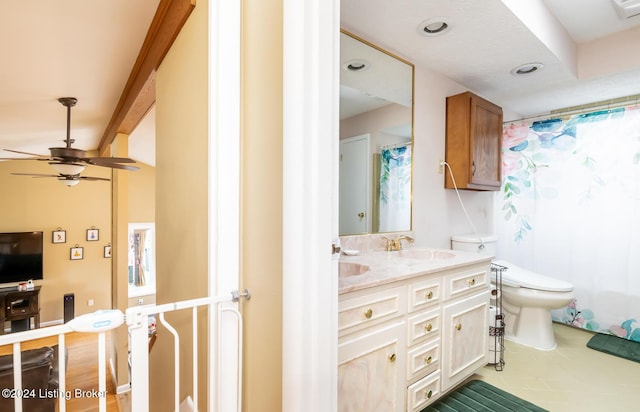 bathroom featuring vanity, toilet, and ceiling fan