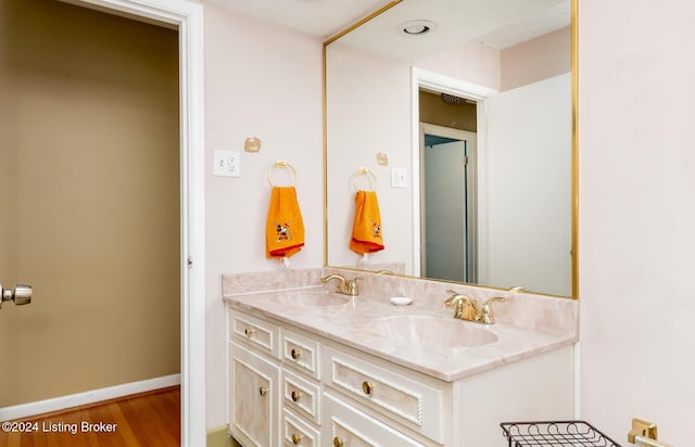 bathroom featuring vanity and wood-type flooring