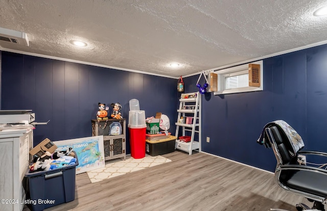 interior space featuring a textured ceiling and hardwood / wood-style flooring